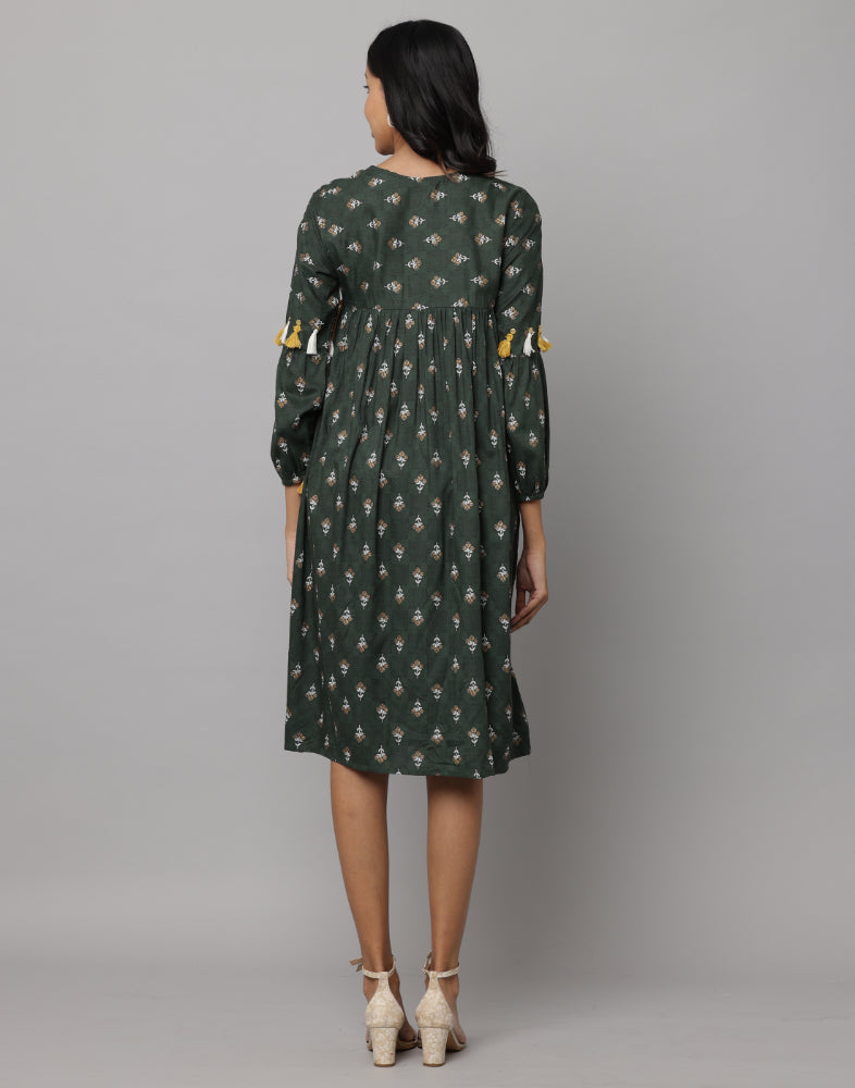 Floral Printed 3/4th Sleeve V Neck Dress Decorated With Tassels & Buttons On Front Neck & Sleeve With A Side Thread String Attached on Waist Side Seam