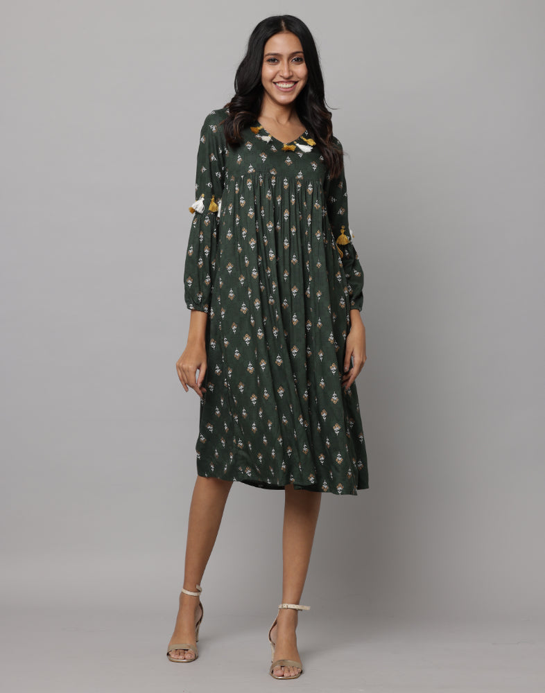 Floral Printed 3/4th Sleeve V Neck Dress Decorated With Tassels & Buttons On Front Neck & Sleeve With A Side Thread String Attached on Waist Side Seam