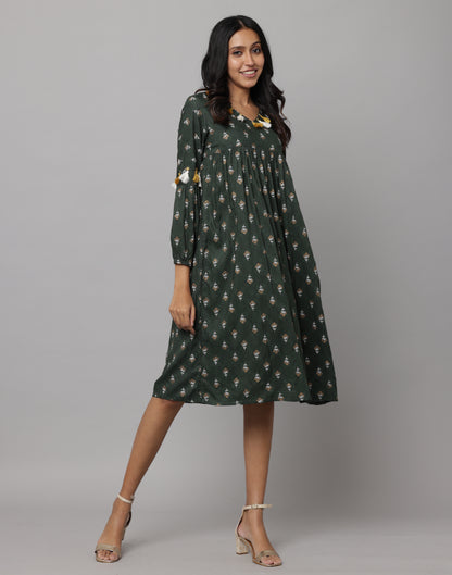 Floral Printed 3/4th Sleeve V Neck Dress Decorated With Tassels & Buttons On Front Neck & Sleeve With A Side Thread String Attached on Waist Side Seam